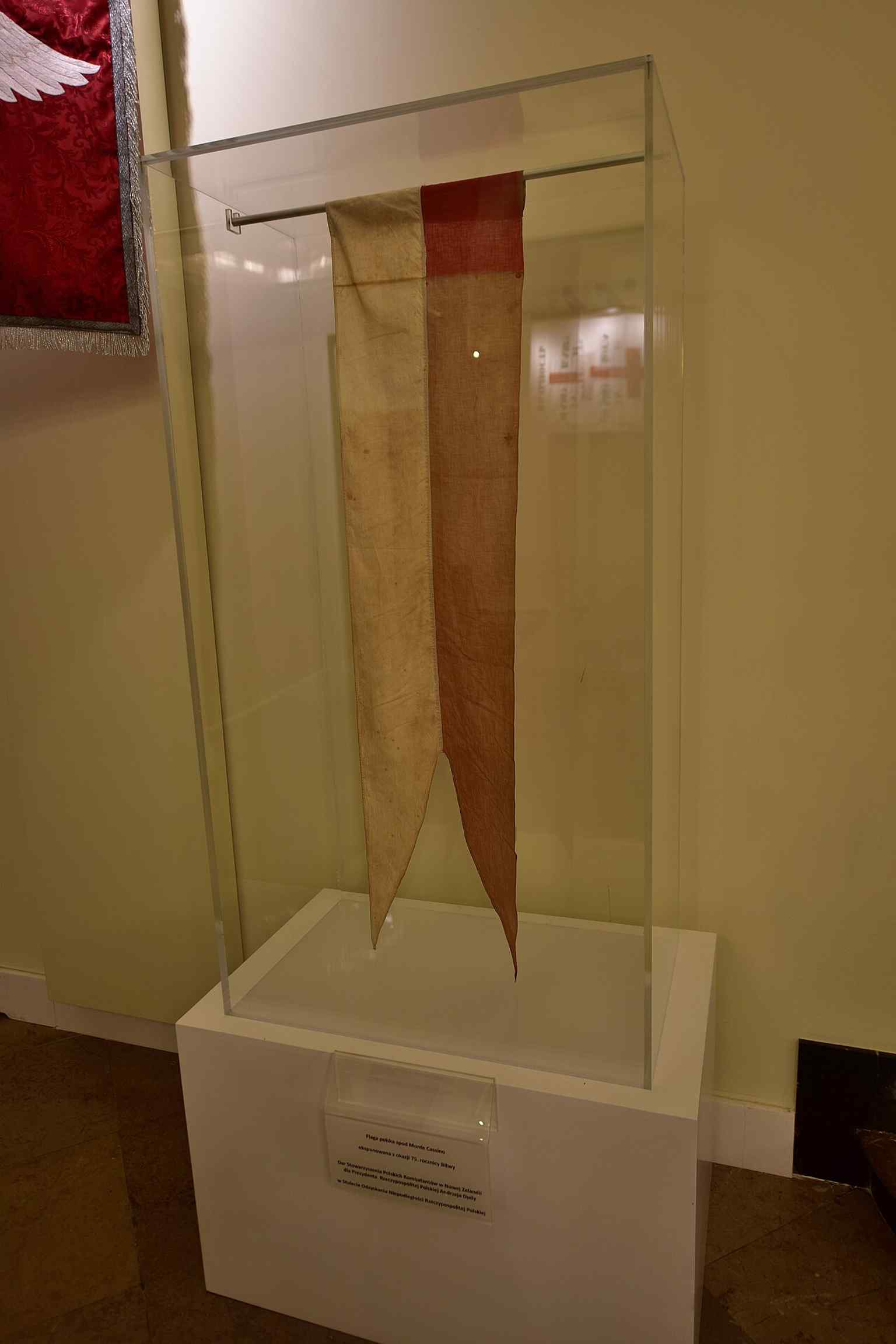 A Polish flag from Monte Cassino displayed inside the palace — one of the many wartime and patriotic commemorations linked to the building.