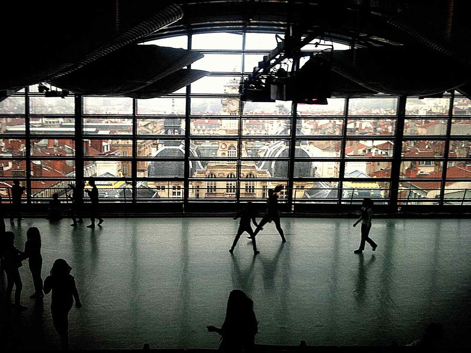 A dance studio inside the opera, looking toward Lyon’s city hall — a reminder that the building now houses the ballet and rehearsal spaces at the top under the glass roof.