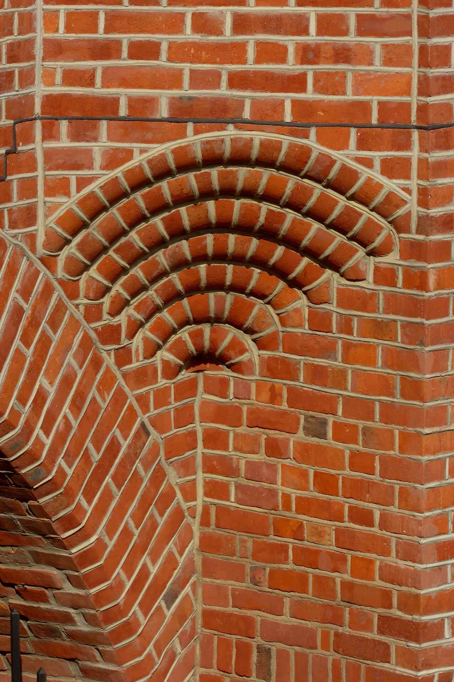 A close architectural detail from the Barbican’s western side, useful for highlighting the brickwork and reconstructed medieval character.