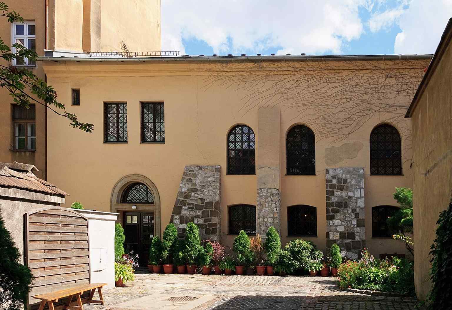 A later exterior photo that captures the restored building in the modern era, after decades of change and reuse.