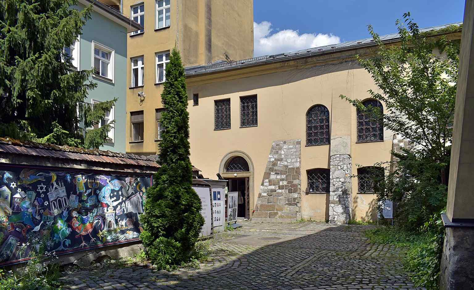 The main exterior of the former synagogue at 16 Szeroka Street, now part of Kazimierz’s busy cultural landscape.