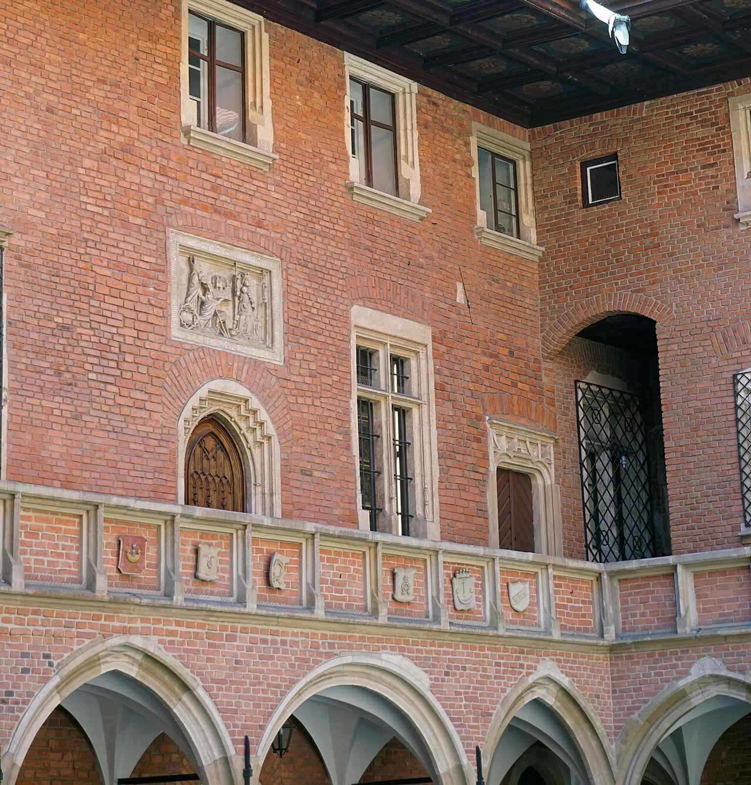The building from Gołębia Street shows how Collegium Maius still anchors the Old Town streetscape beside the university quarter.