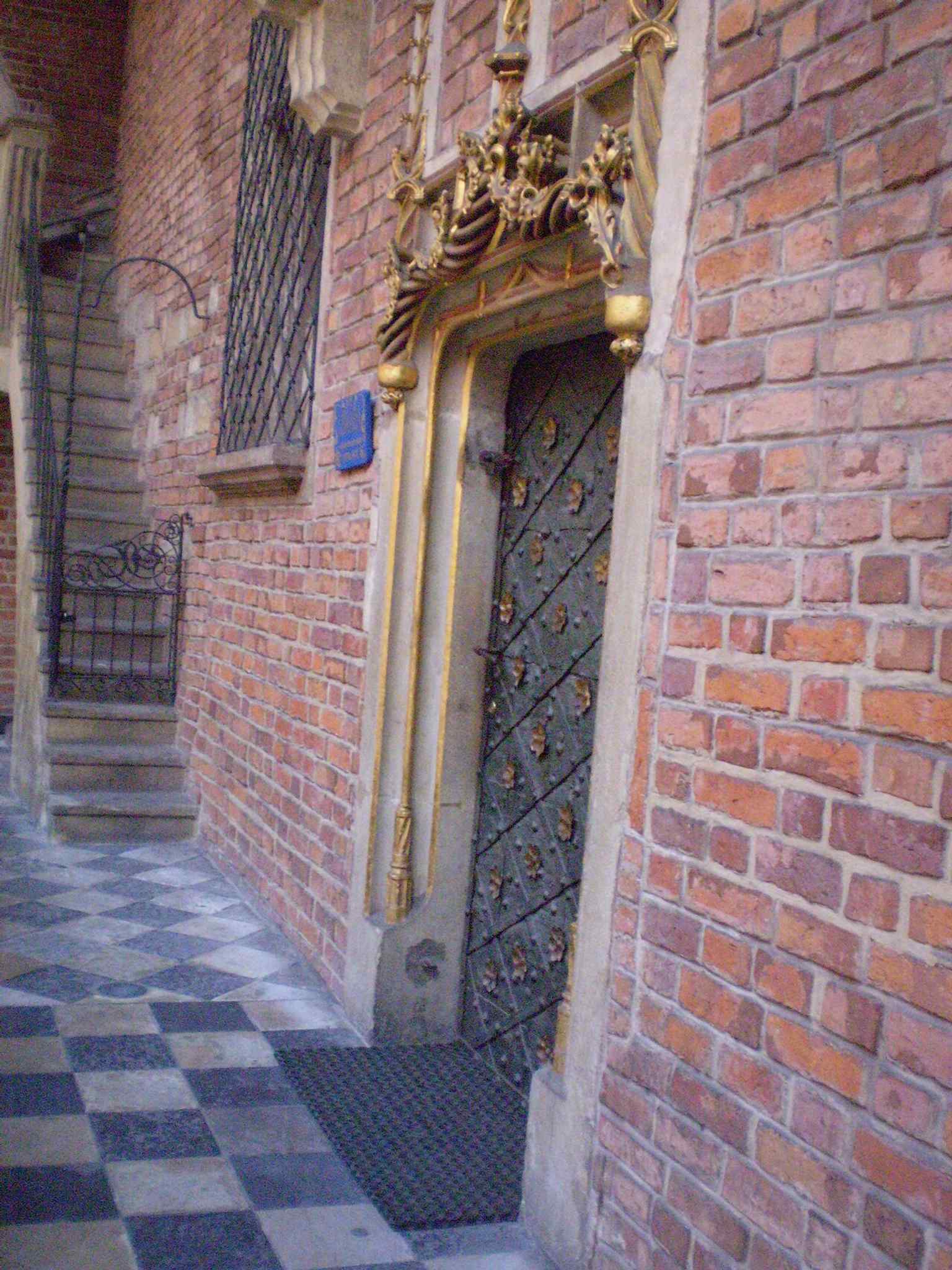 A close look at the carved courtyard doorway, one of the building’s Gothic details preserved in the university complex.