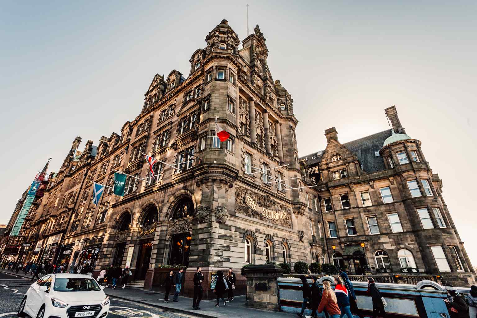 The impressive exterior of The Scotsman Hotel, a grand sandstone building bridging the old and new towns (2019).