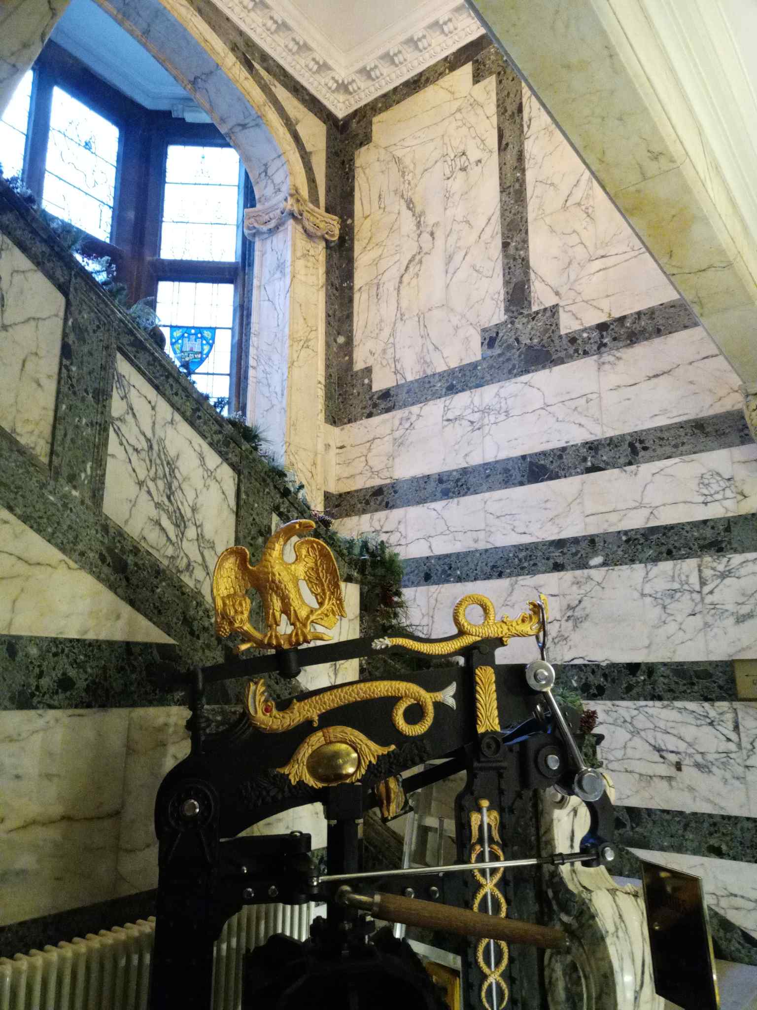 The grand interior stairwell of the hotel, beautifully preserved and renovated from its frenetic newspaper days (2022).