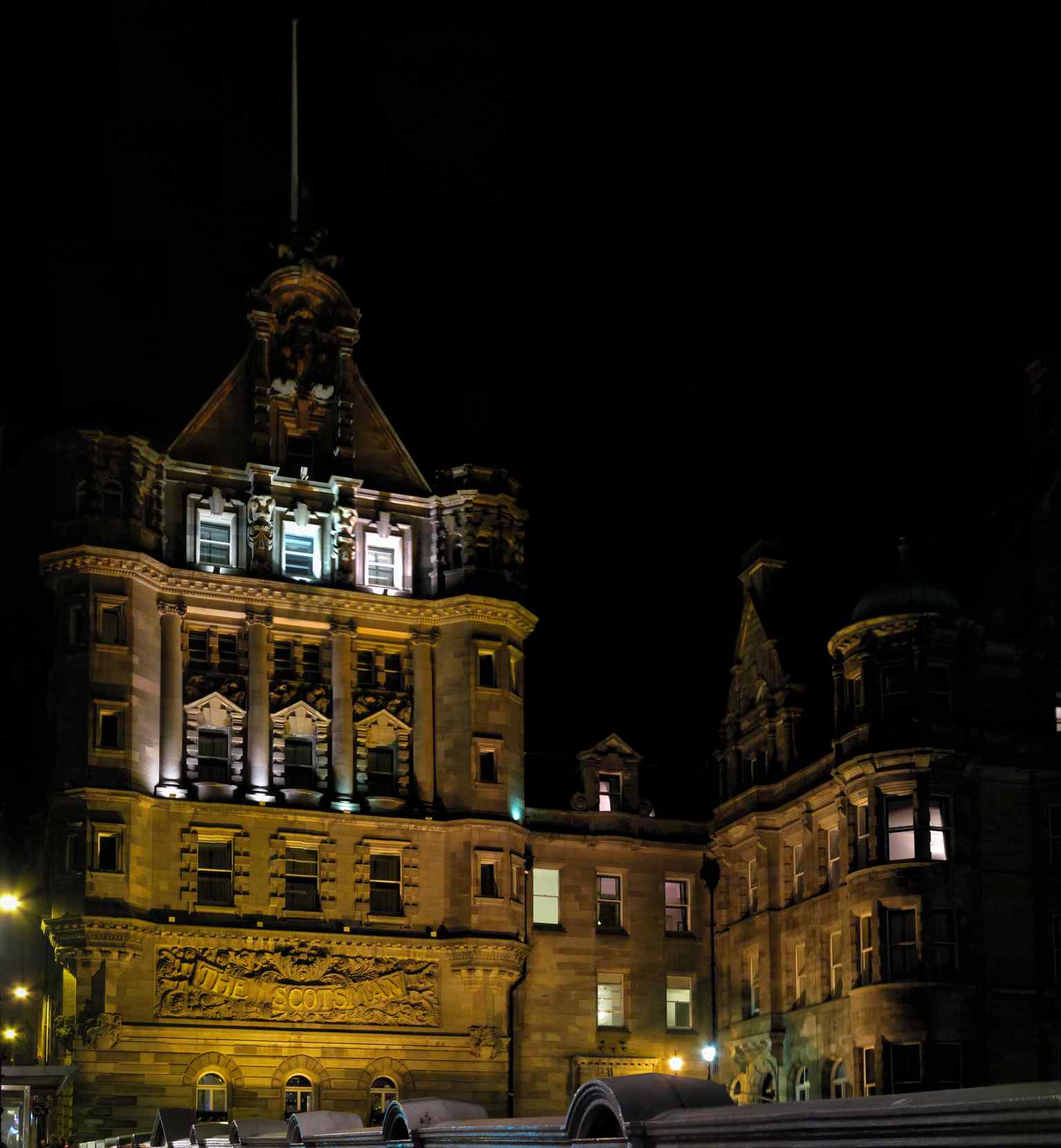The Scotsman Hotel floodlit at night, lending an eerie atmosphere to the allegedly haunted former newspaper offices (2013).
