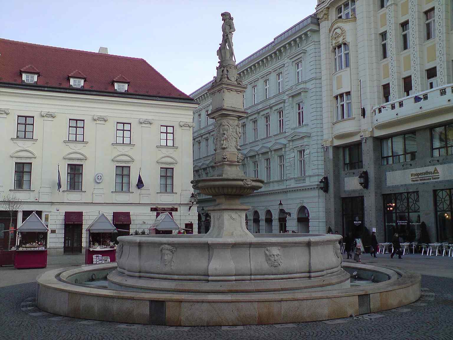 A clear daytime view of Maximilian’s Fountain on Bratislava’s Main Square, where the city’s oldest fountain has stood since 1572.