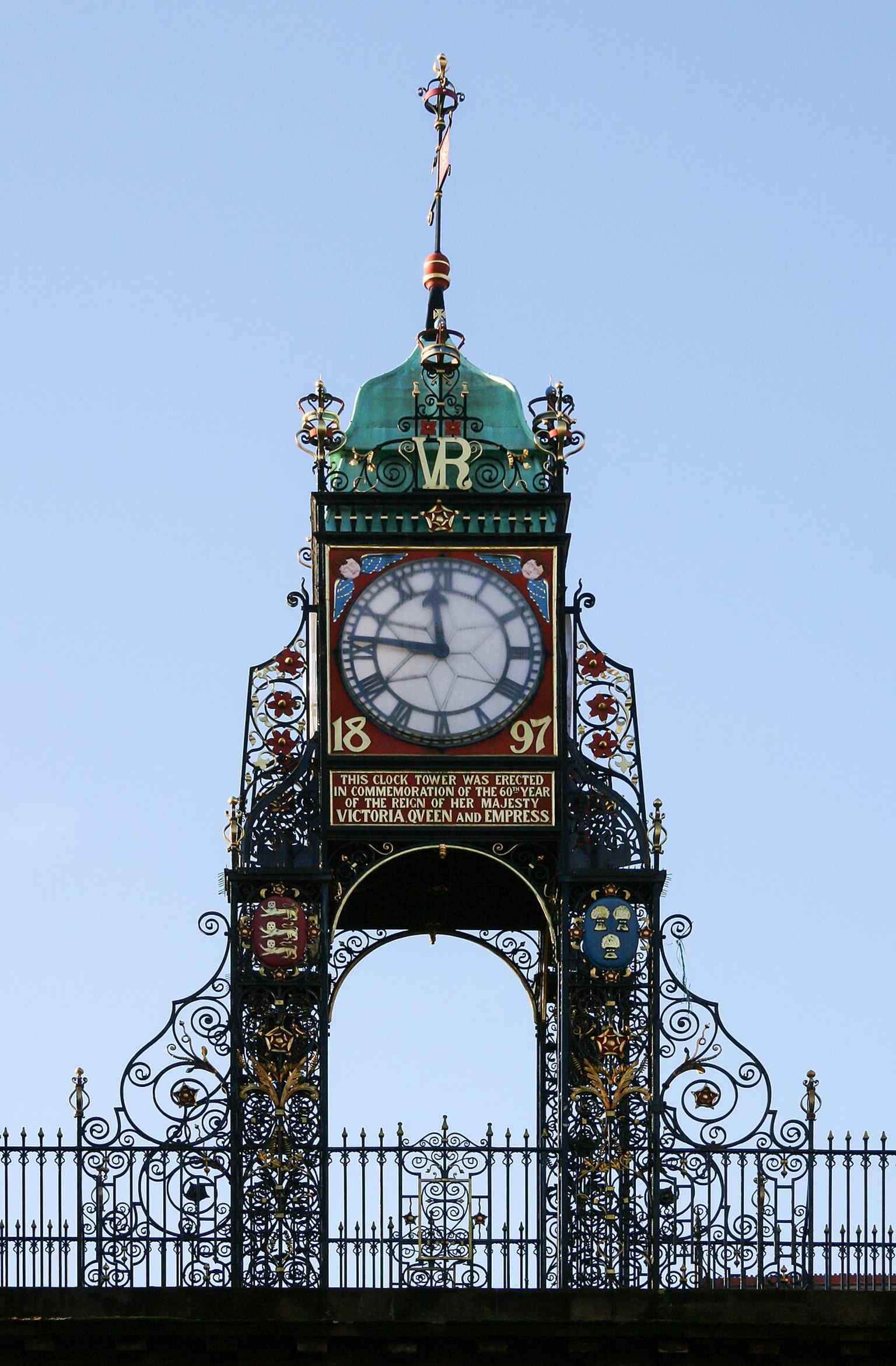 A close-up of the clock face and ironwork, illustrating John Douglas’s openwork design and the four-sided clock that made it so famous.