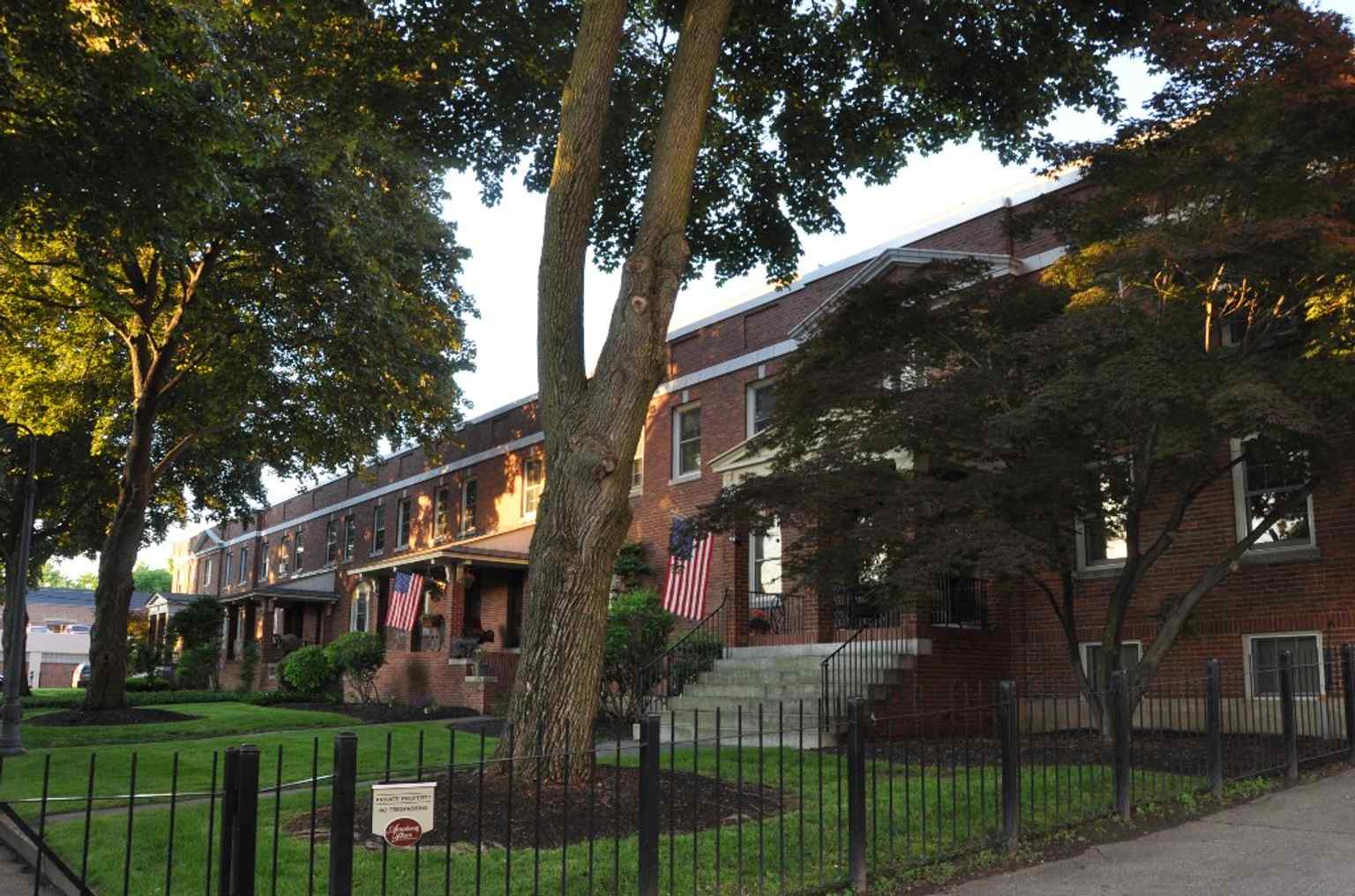 Front view of a District C rowhouse, showing the brick worker housing built for Amoskeag employees and later converted to condominiums.