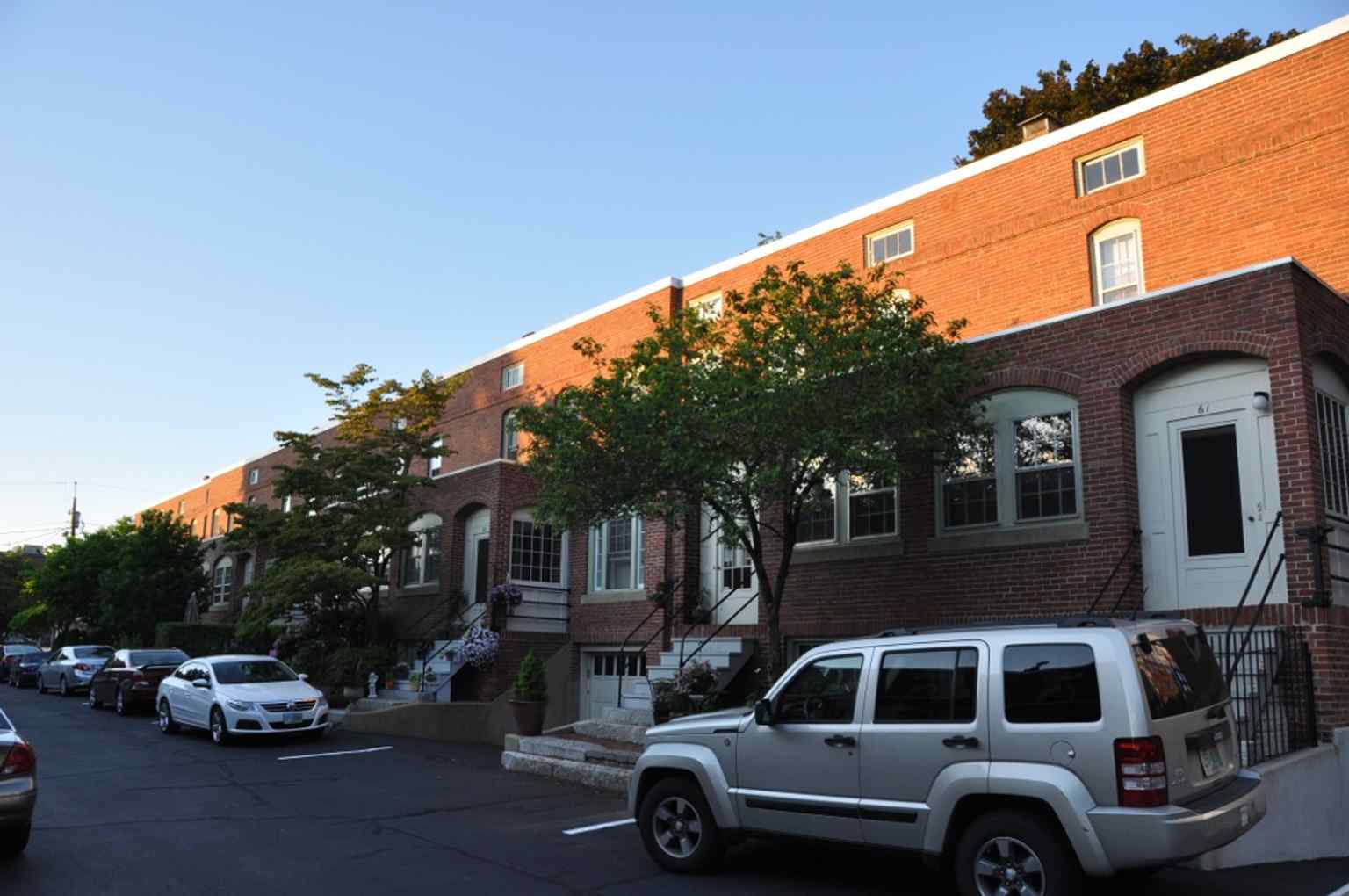 Rear side of a District C rowhouse, where the two-story back projection and porch helped make each unit a full family home.