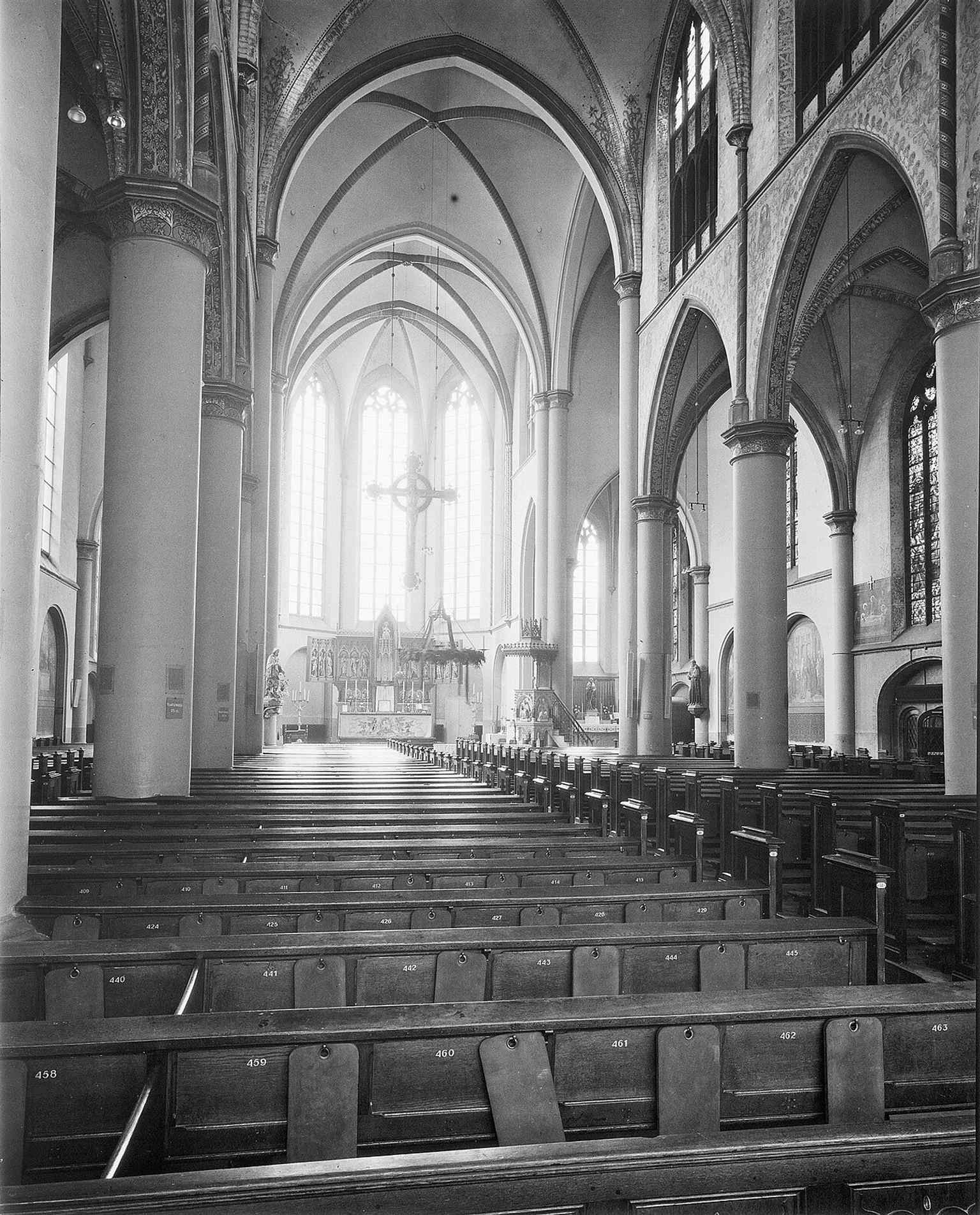 This 1960 interior view toward the east shows the church’s long nave and choir, a good example of Alfred Tepe’s neo-Gothic spatial design.