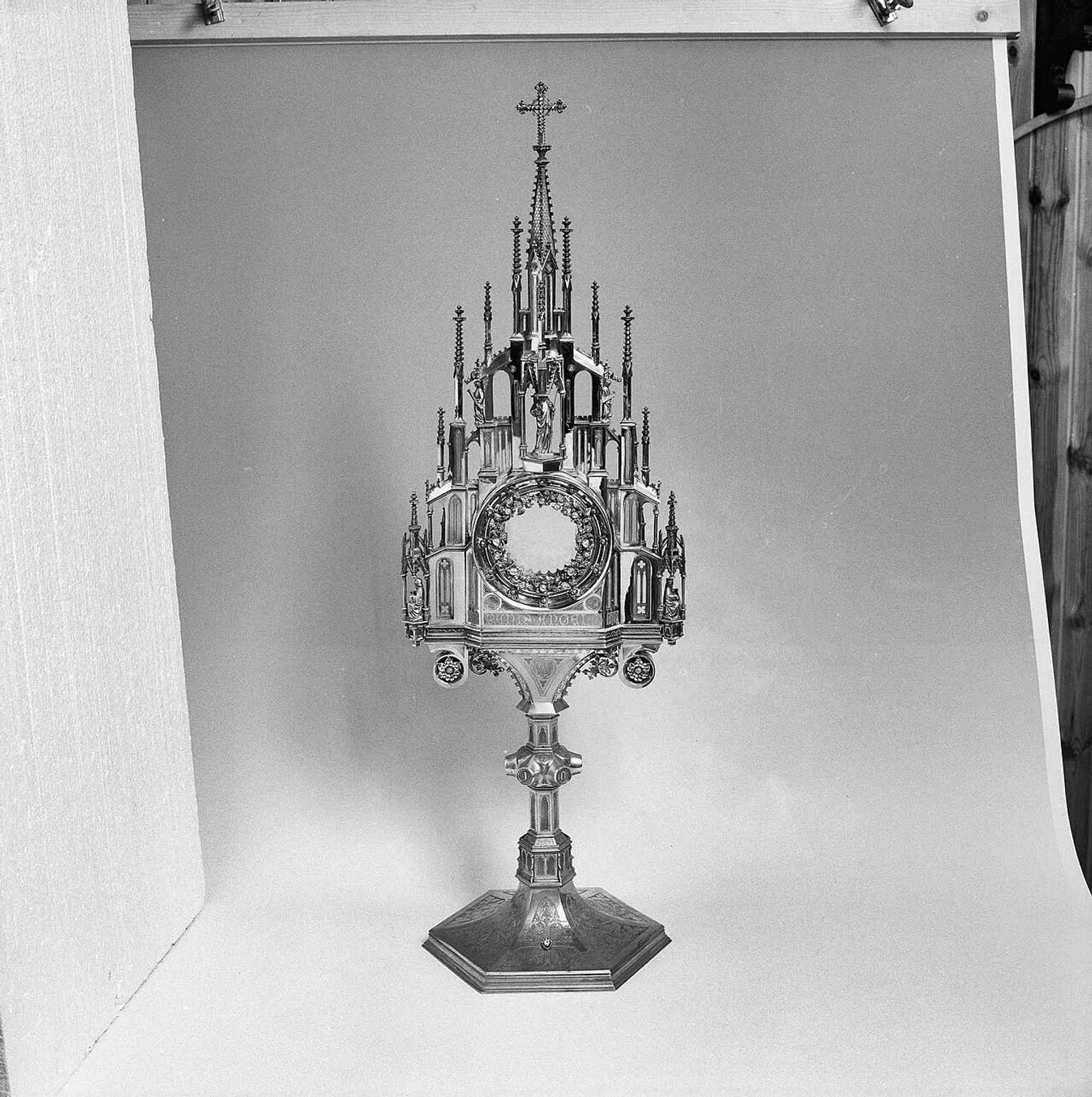 The monstrance illustrates the church’s sacramental treasures and its role as a place for Catholic worship and procession objects.