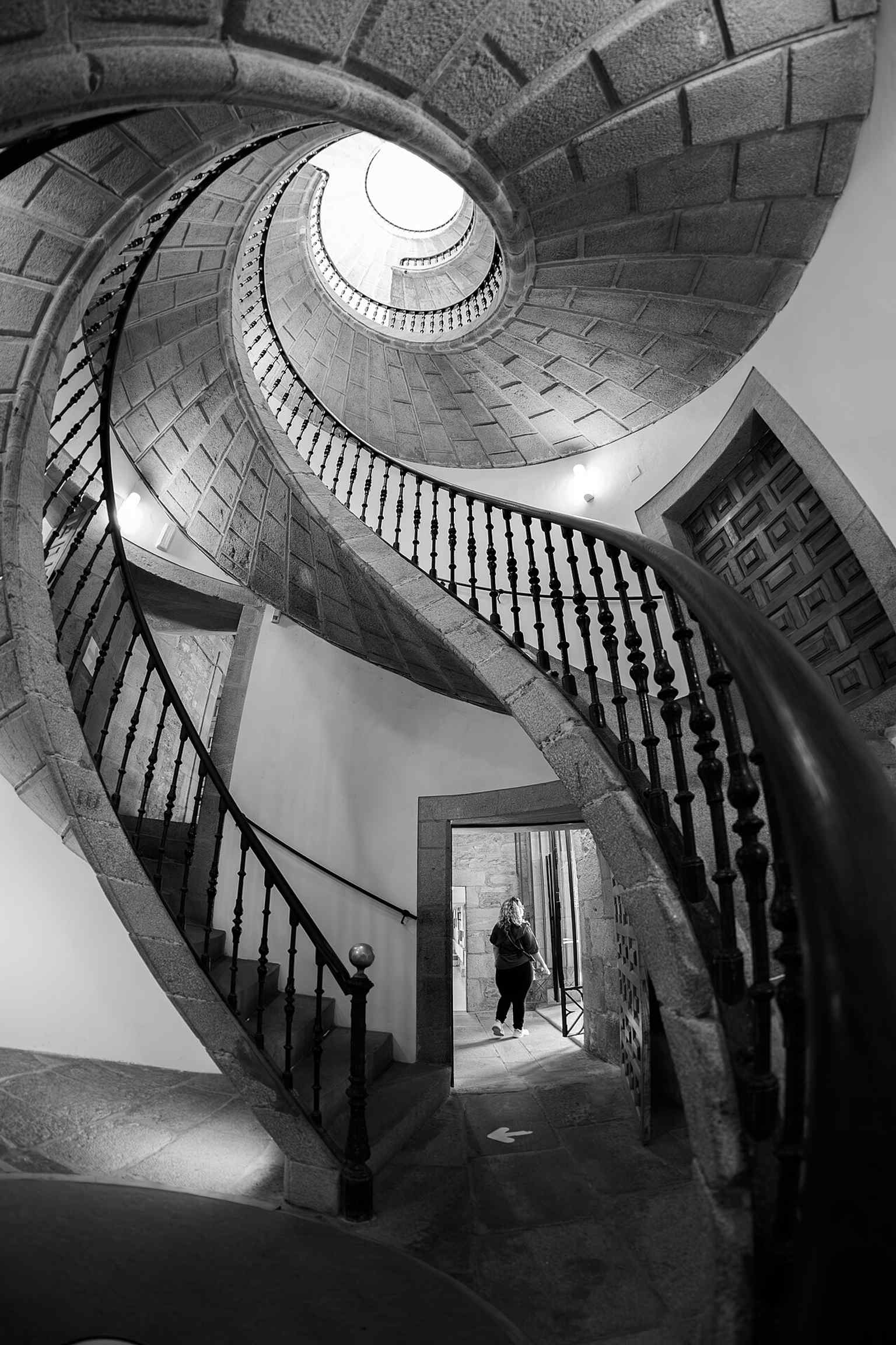 The museum features a unique triple helical stone staircase, a Baroque engineering masterpiece by Domingo de Andrade, designed so monks could access different floors without crossing paths.