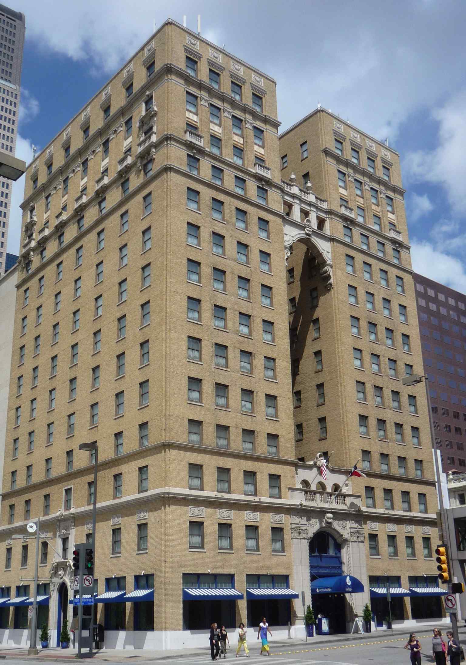 This image shows the exterior of the Hotel Indigo Dallas Downtown, originally opened in 1925 as the Hilton Hotel – the first hotel Conrad Hilton ever built to bear his own name.