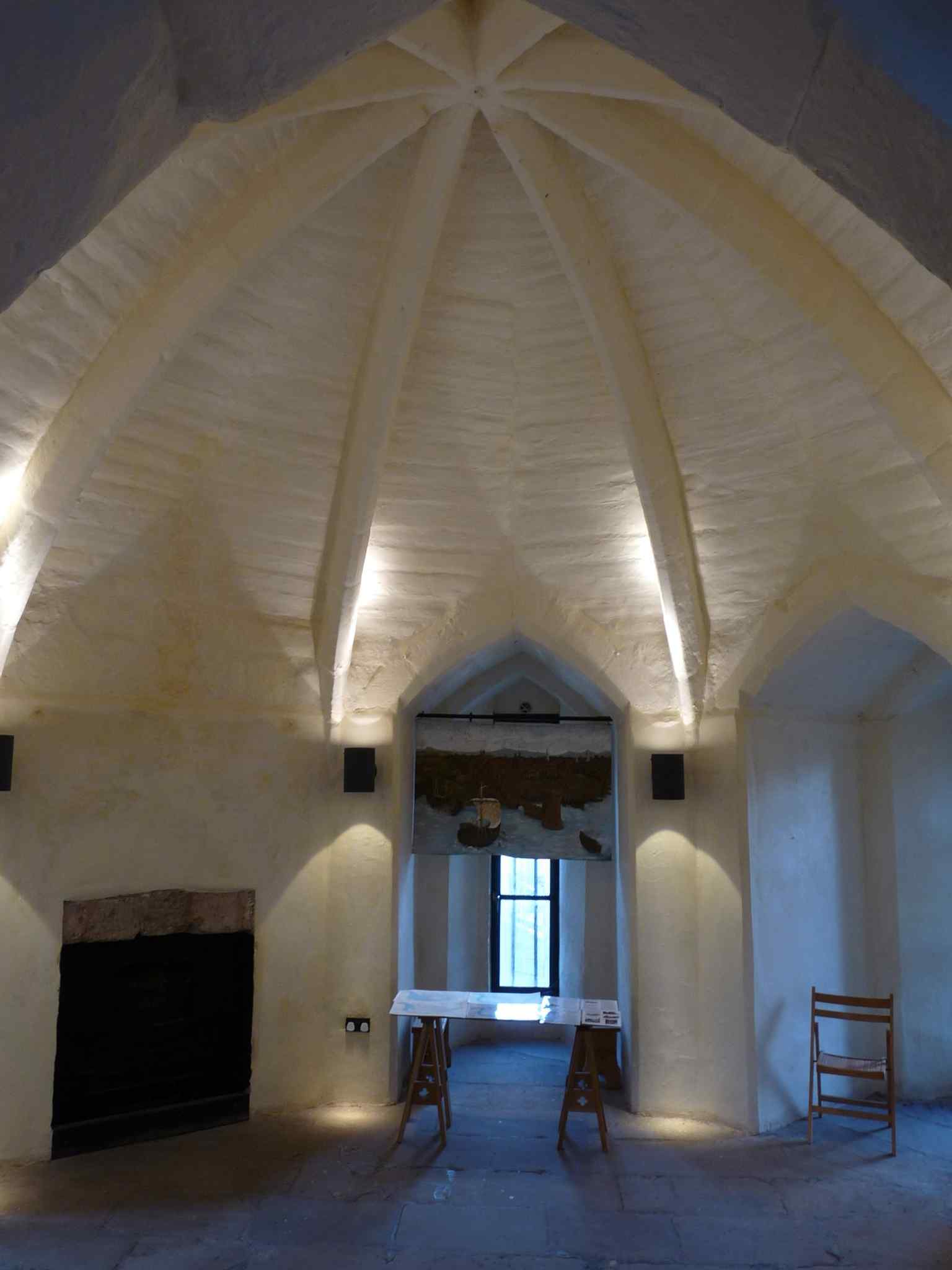 The wall-level chamber inside the tower, showing the layered interior layout behind the city walls.