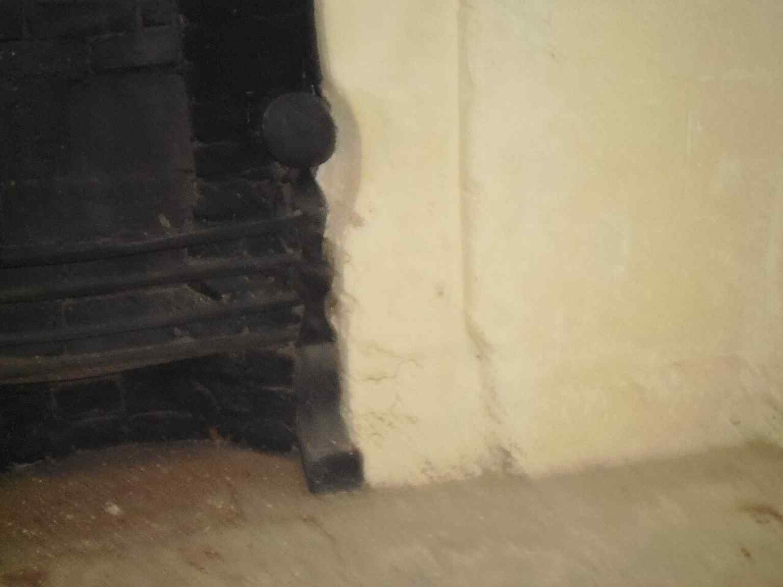 Close detail of the fireplace, highlighting how the tower was adapted and reused long after its defensive role faded.