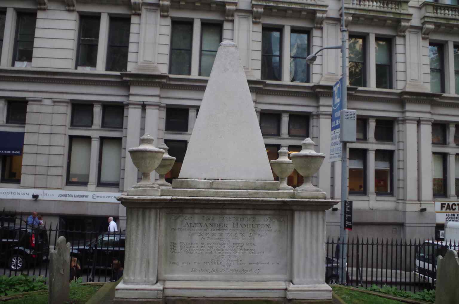 This grave belongs to Alexander Hamilton, who is buried in the Trinity Churchyard near his eldest son, Philip, who died defending his father's honor.
