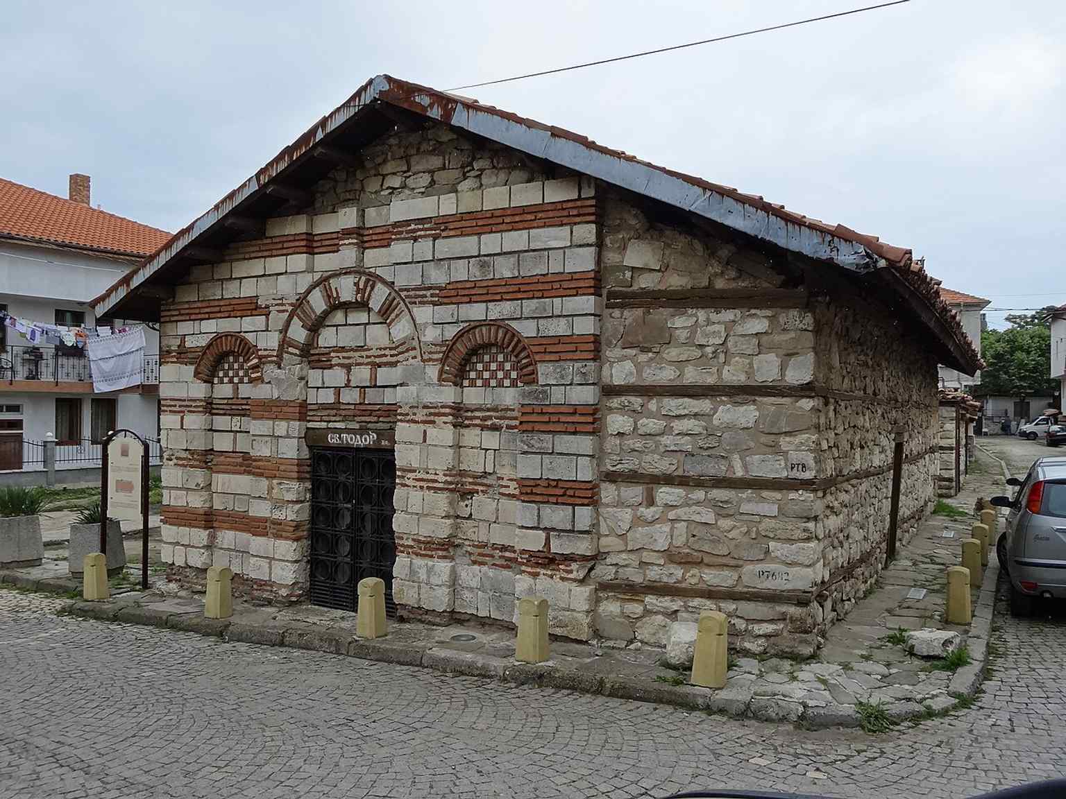 The surviving church exterior, showing the small medieval building that preserves 13th-century fabric from St Theodore’s time.