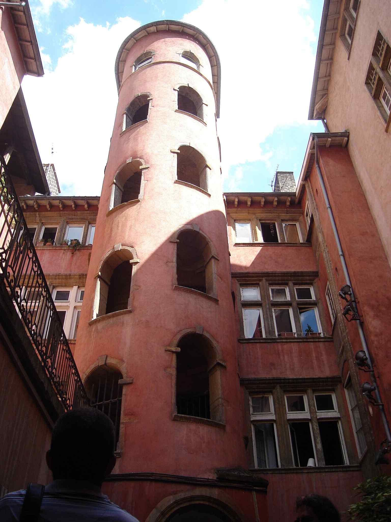 The rose-colored tower on Rue du Bœuf — the landmark’s nickname comes from this striking ocre stair tower in Old Lyon.