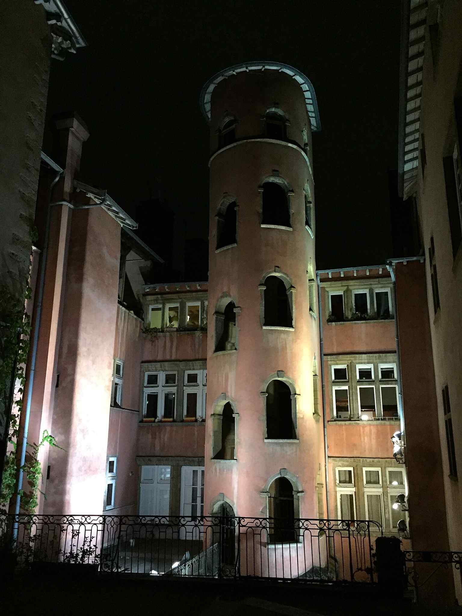The courtyard and rose tower together — a classic view of the monument hidden behind the ordinary street frontage.