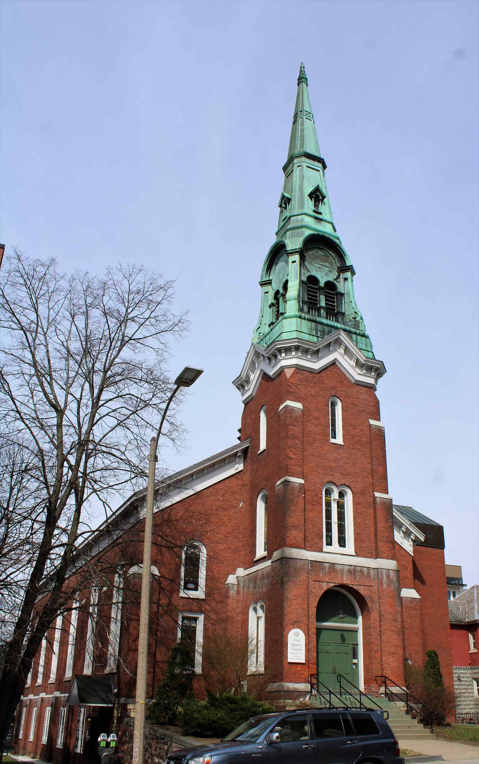 The church's iconic red brick exterior wasn't original; it was clad in wood until a major 1905 renovation, when the stained glass windows were also installed.