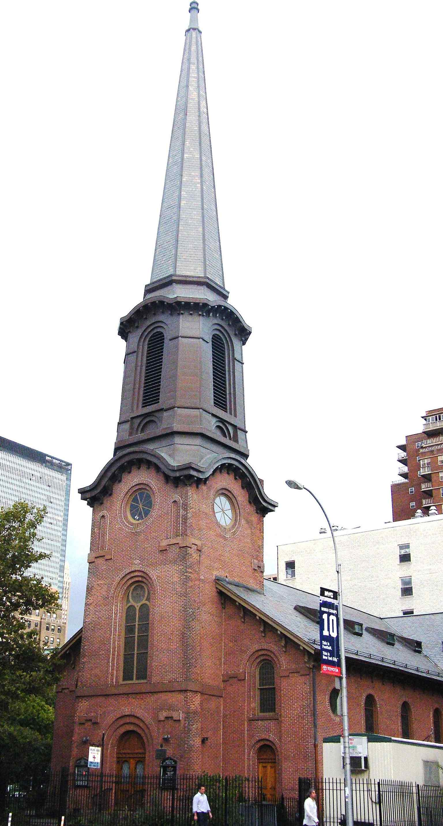 Street-level view of the Church of the Holy Apostles at 300 Ninth Avenue, the historic Chelsea landmark facing Chelsea Park.