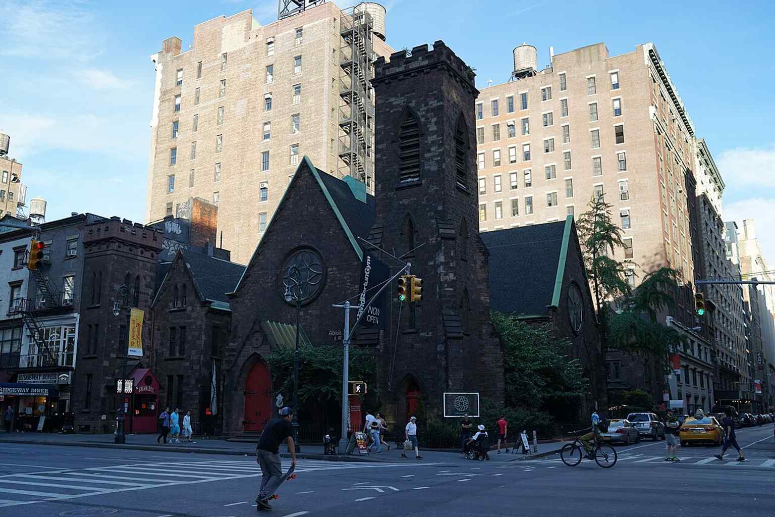 The corner view shows the church complex on Sixth Avenue and West 20th Street, where Richard Upjohn’s Gothic Revival design still anchors the Flatiron District.