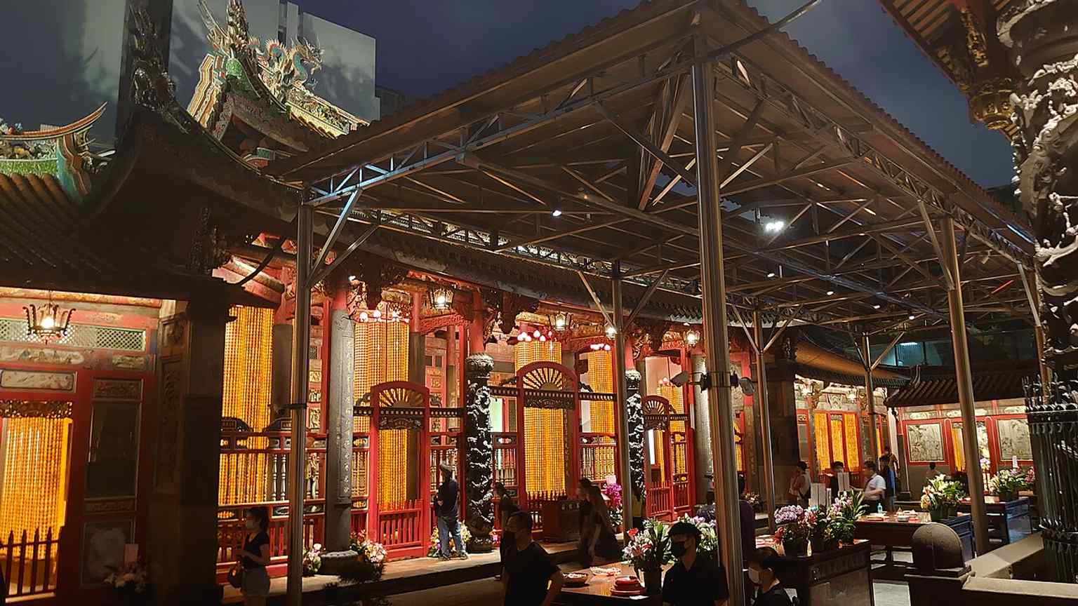 A night view of the apse and rear hall, highlighting how the temple complex glows after dark and emphasizing its layered architecture.