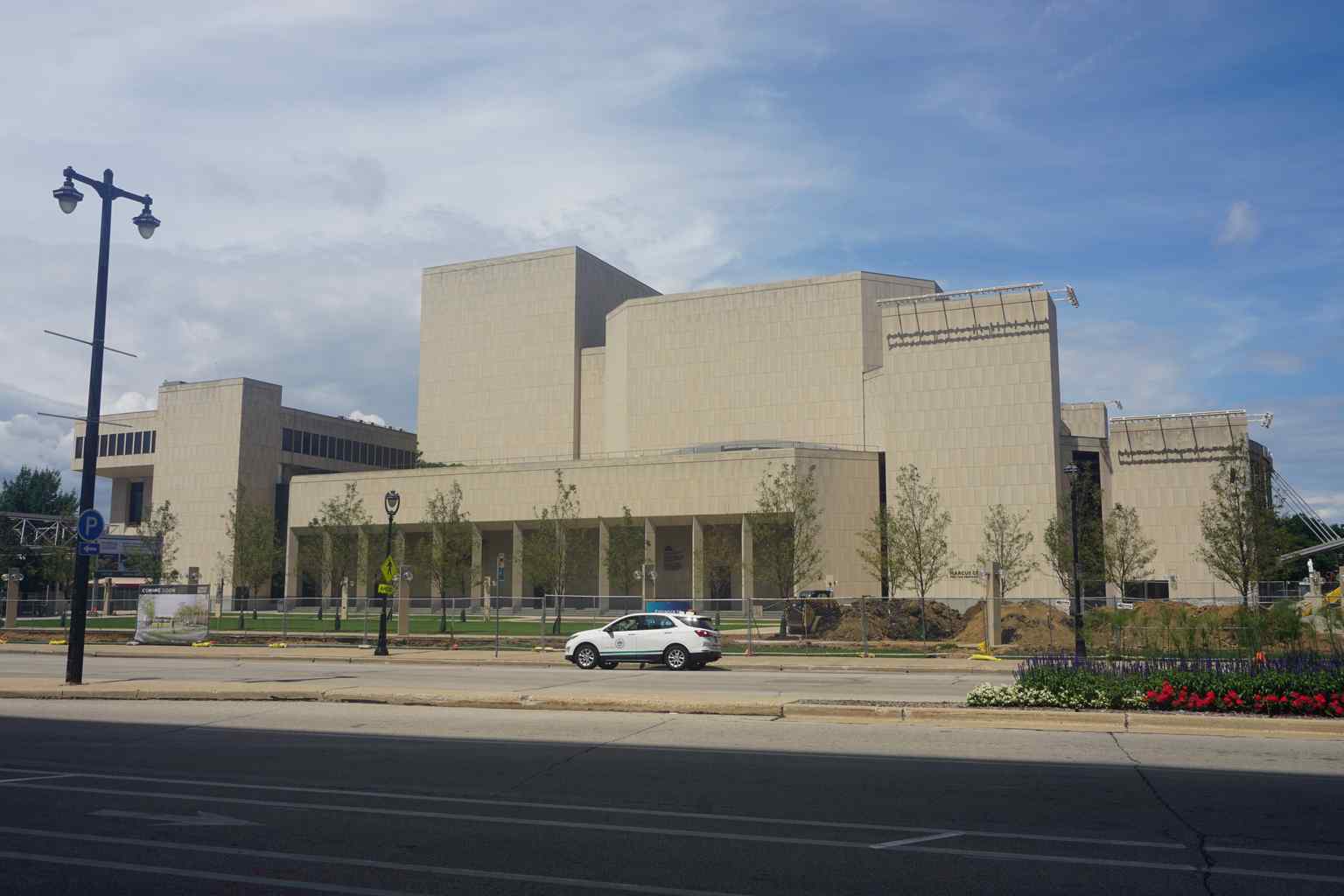 This view of the Marcus Center's exterior from 2022 shows the building after its 1994 renovation, which replaced the original white travertine marble with limestone and brick, a change criticized by architectural purists.