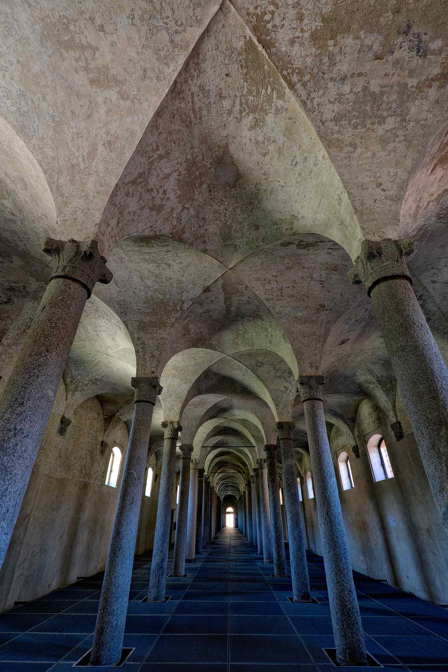 A glimpse into the castle's grand internal architecture, which once included three stables and ducal kitchens, reflecting the functional elegance of the Sforza court.