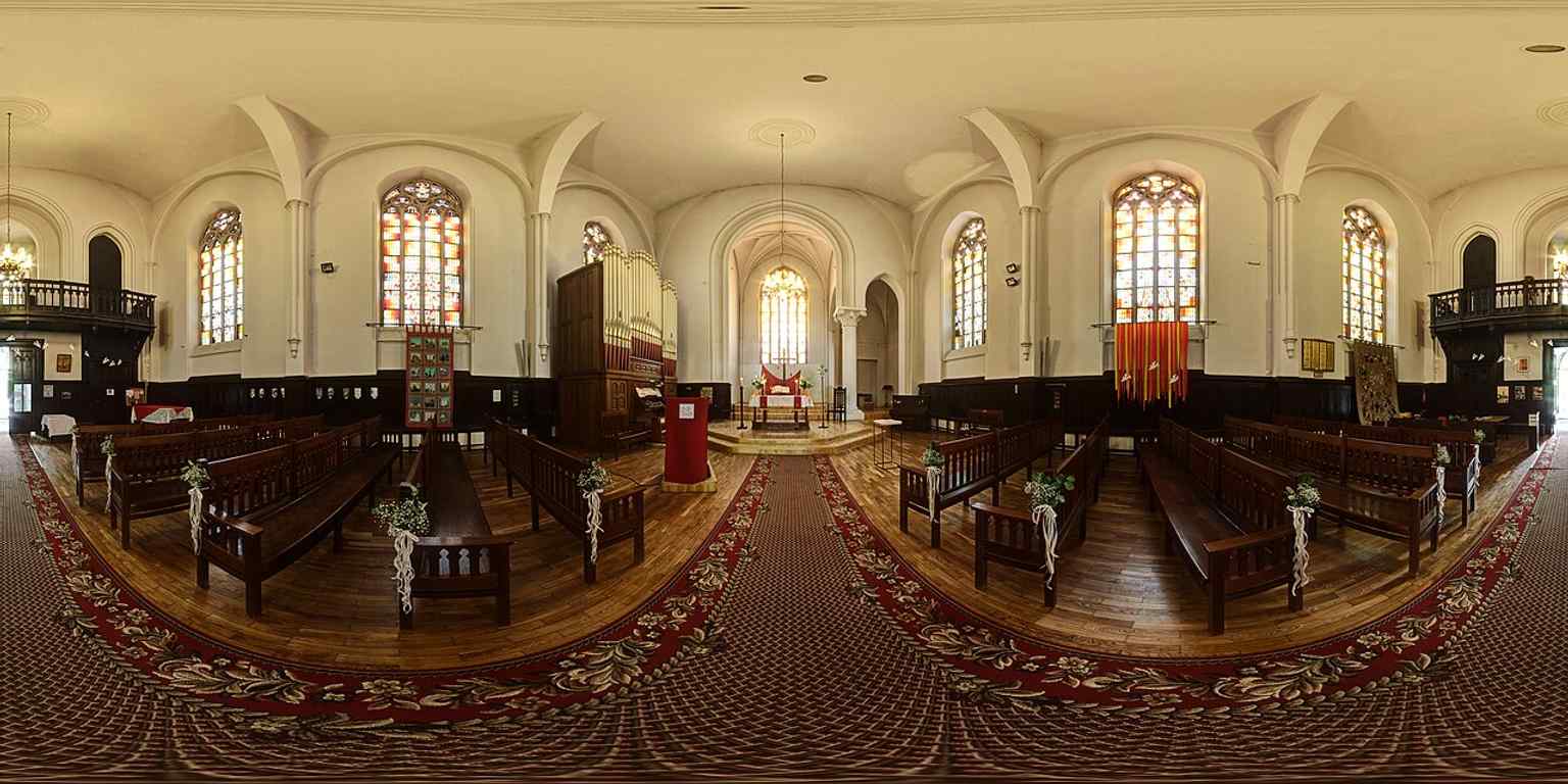 The church’s nave interior, where restored stained glass and the single-vessel hall create the acoustic space later used for concerts and recordings.