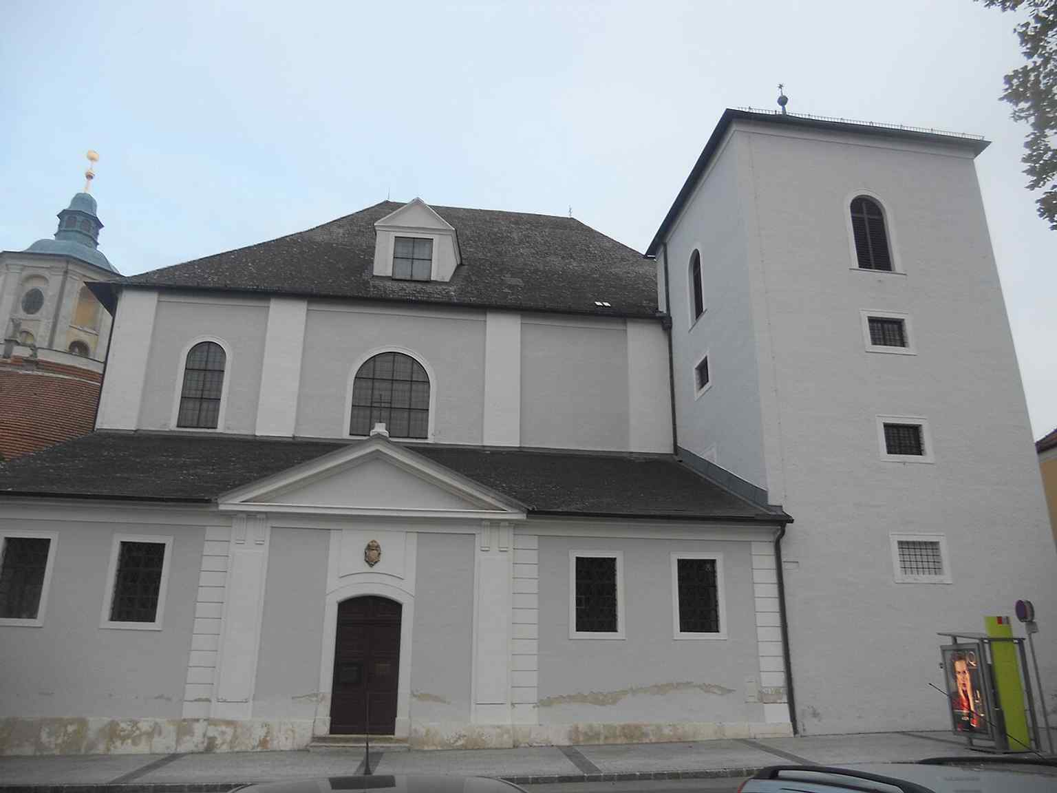 The church façade in daylight, showing the distinctive west front of the Haydnkirche and its historic pilgrimage architecture.