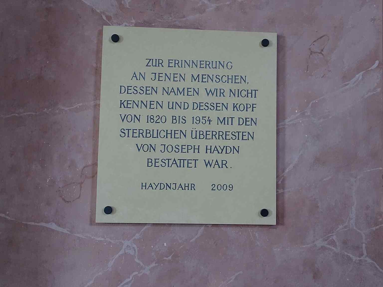 Another inscription linked to Haydn’s burial and the story of his remains, part of the church’s unusual memorial history.