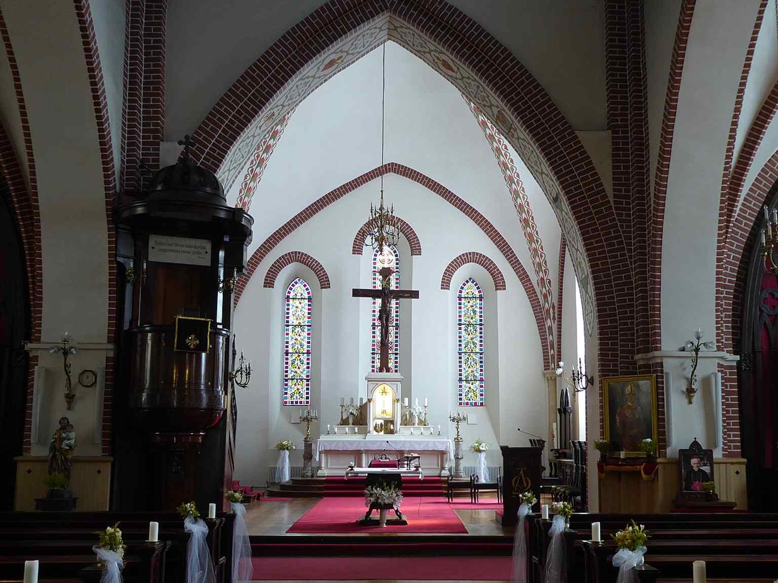 An interior perspective that highlights the church’s sober Gothic structure and later Catholic fittings.