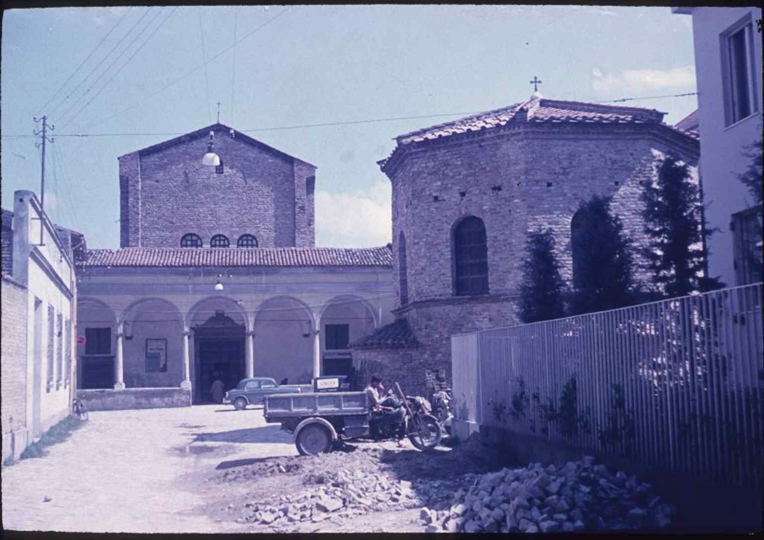 A 1957 view showing the baptistery beside the Santo Spirito church, recalling the separate Arian district that once formed this episcopal complex.