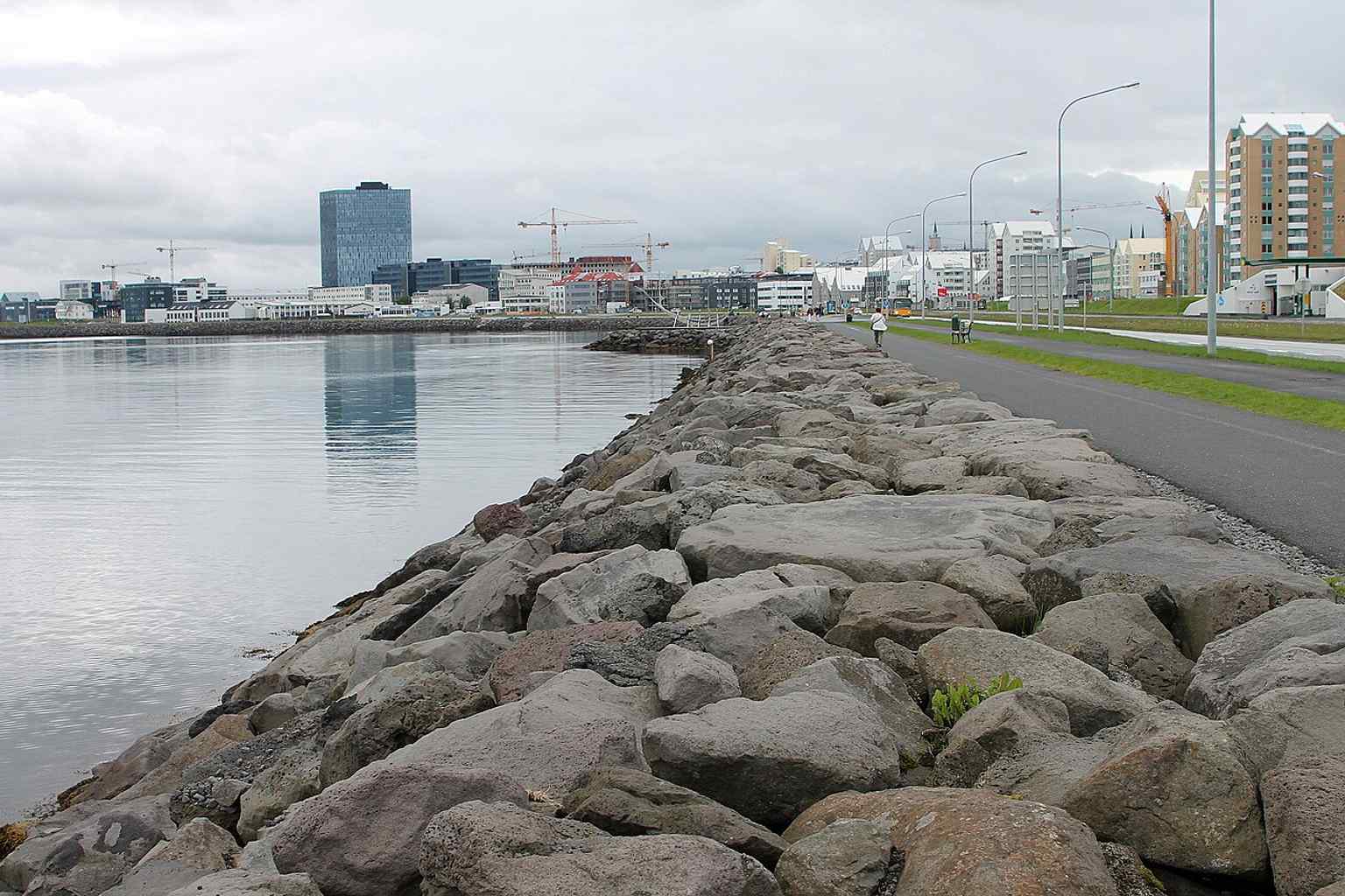 Sun Voyager by the Reykjavík waterfront, beside the sea-facing promenade — the sculpture was unveiled here in 1990 as a dreamboat for hope and freedom.