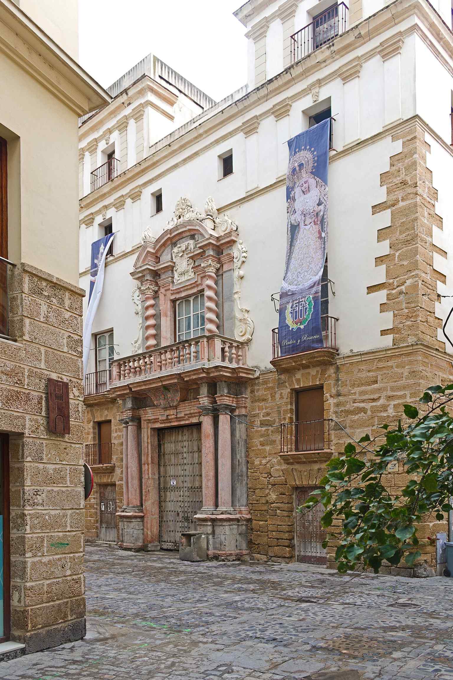 The Baroque façade of Casa del Almirante in Cádiz, built for the family of Diego de Barrios and noted for its monumental Genoese marble portal.