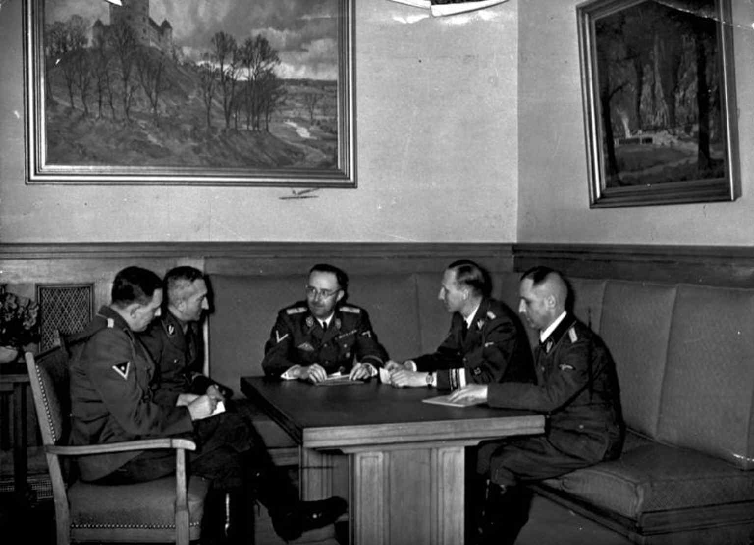 Himmler meeting Heydrich and Gestapo officials in Munich, illustrating the SS command circle behind state terror.