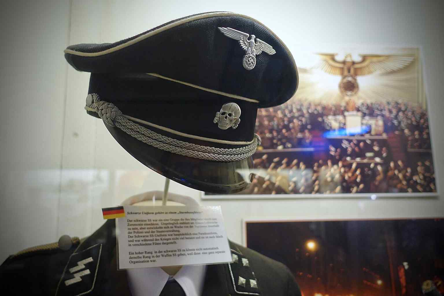 An Allgemeine SS black parade uniform on display, with the Totenkopf skull that signalled willingness to fight to the death.