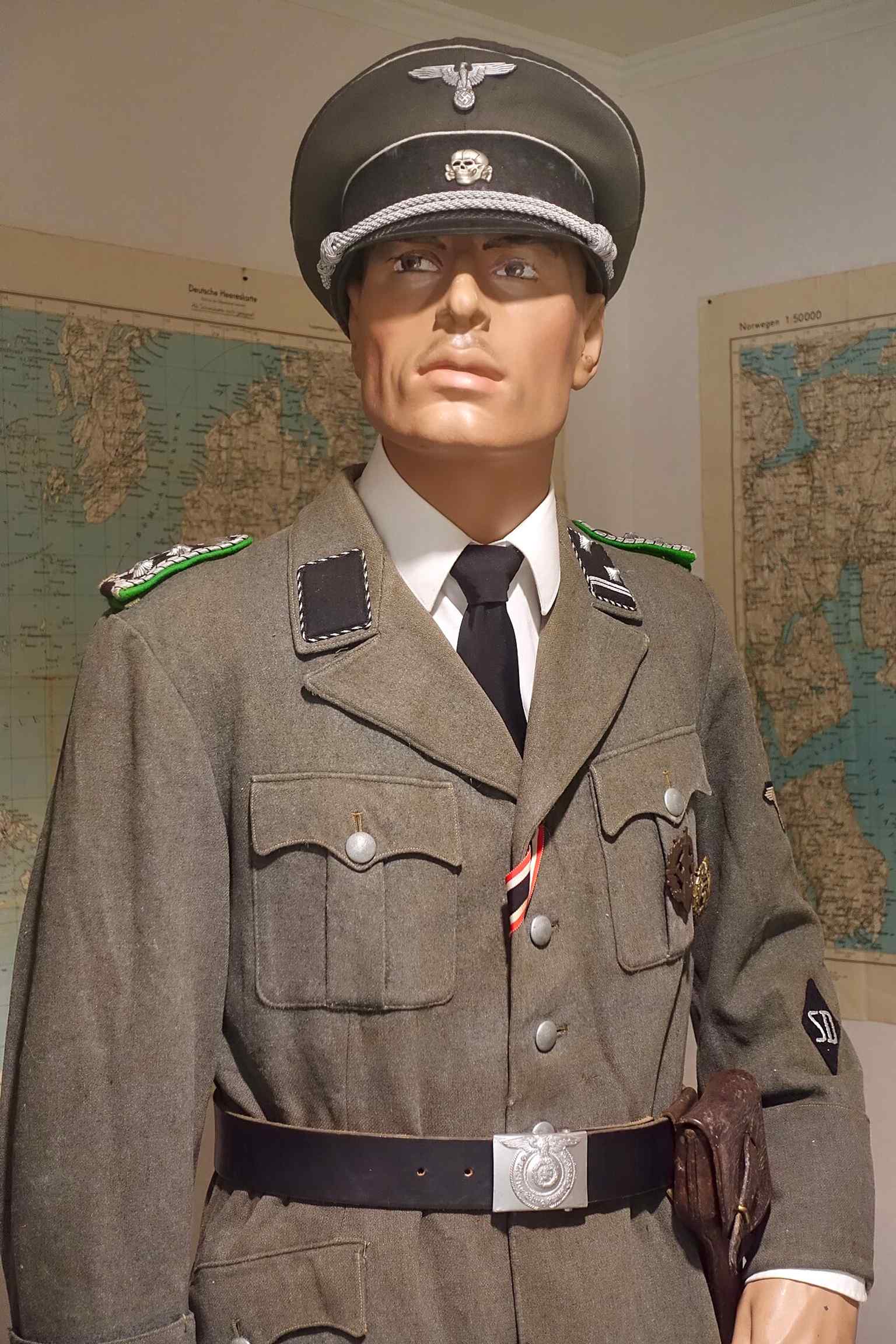 An SD officer’s uniform from occupied Norway, linking the SS to security policing, intelligence, and occupation rule.
