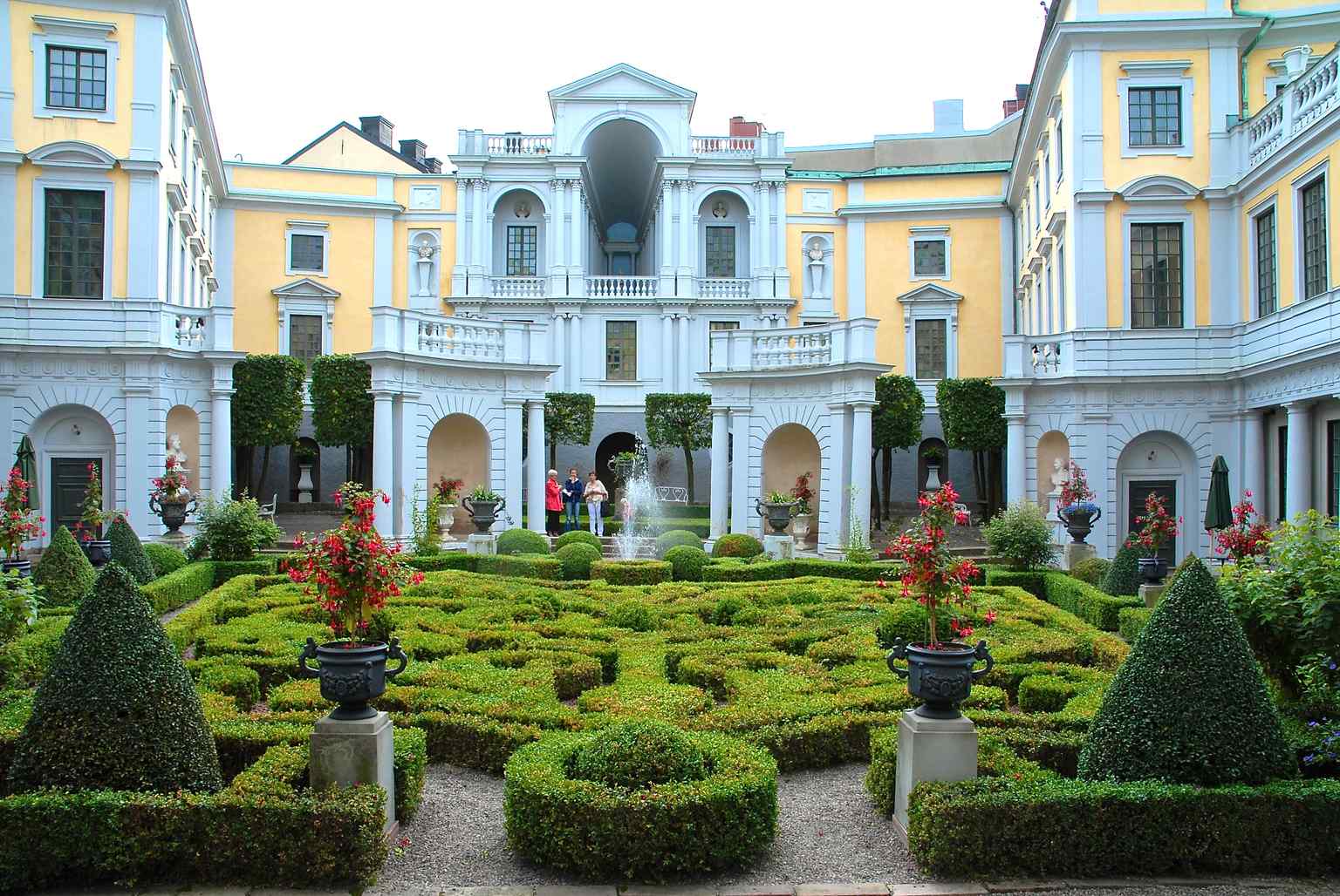 A view of the palace's garden, designed with French influences admired by Tessin, showing the meticulous layout and central fountain.