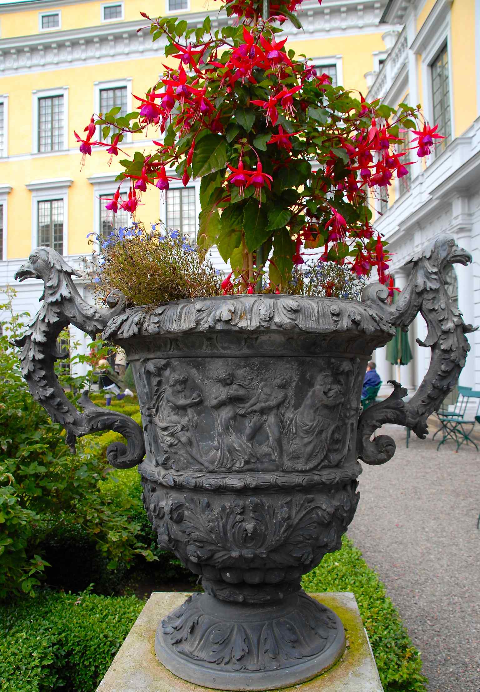 An ornate garden vase, typical of the Baroque aesthetics found within the palace's meticulously planned gardens.