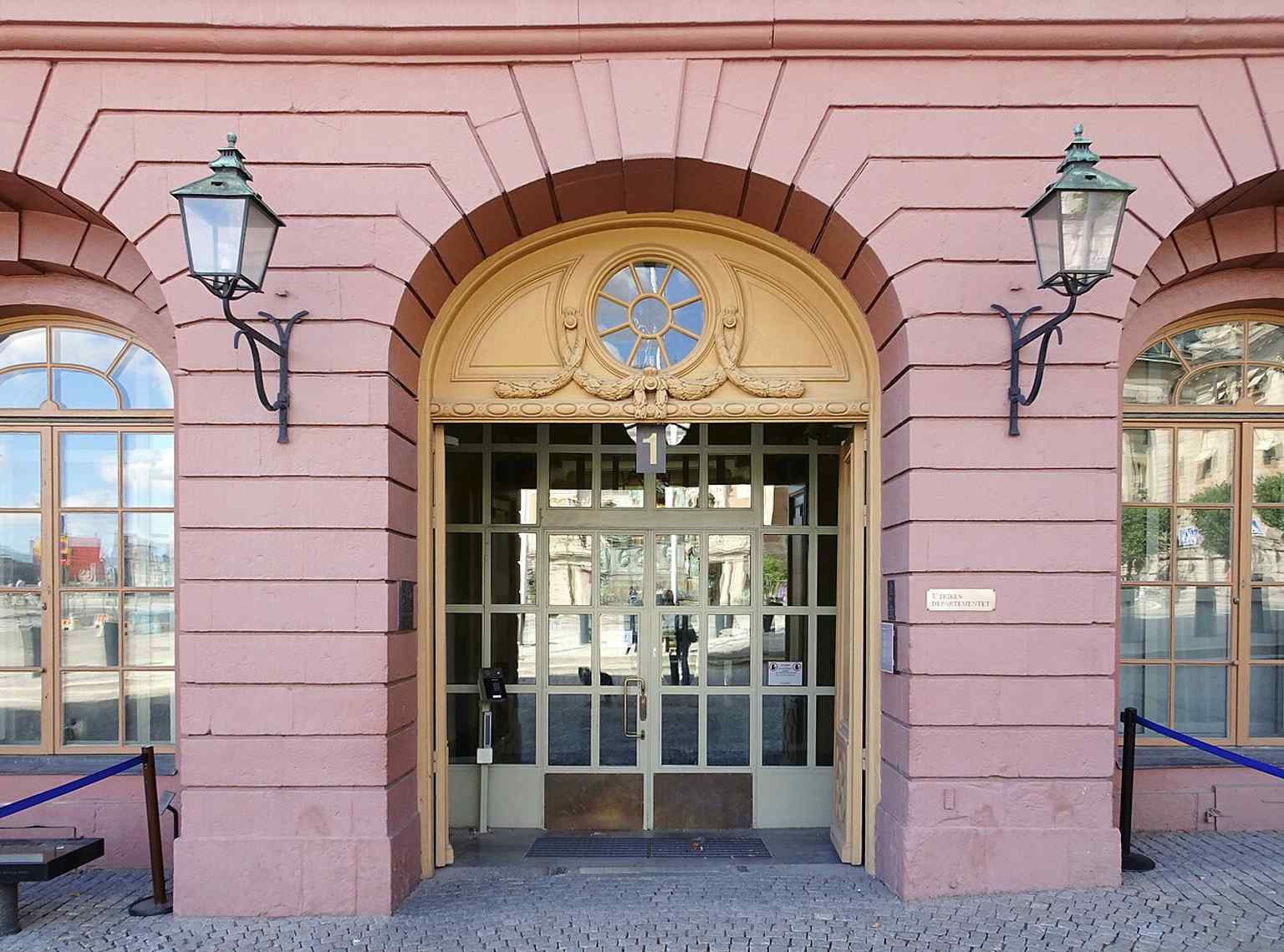 The grand main entrance of the palace on Gustav Adolfs Torg 1, the primary public access point.