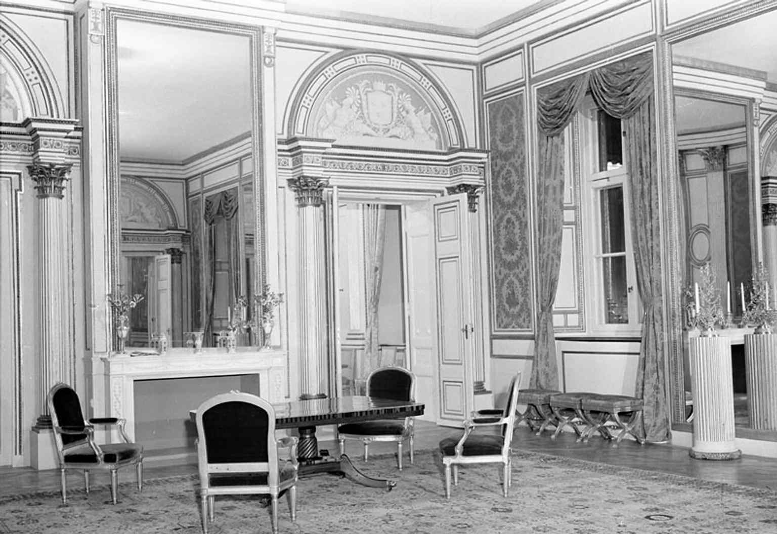 The historic Red Salon, once Princess Sofia Albertina's reception room, now serves as a waiting room for the Foreign Minister.