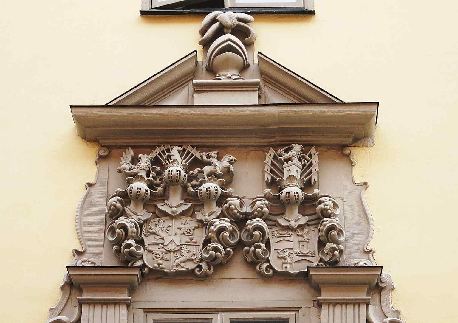 A detail of the original 1647 sandstone portal by Didrik Blume, featuring the coats of arms of Lennart Torstenson and Beata de la Gardie.