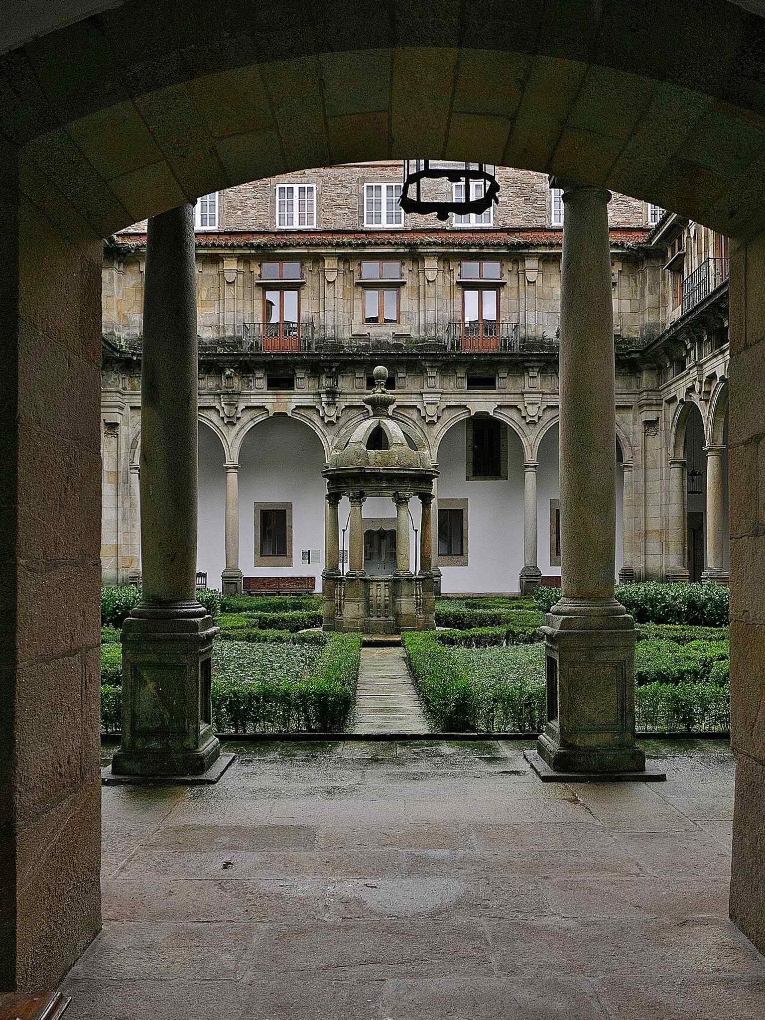 This entrance leads to the Patio de San Mateo, one of the two Baroque courtyards added later, completing the building's Greek cross layout.