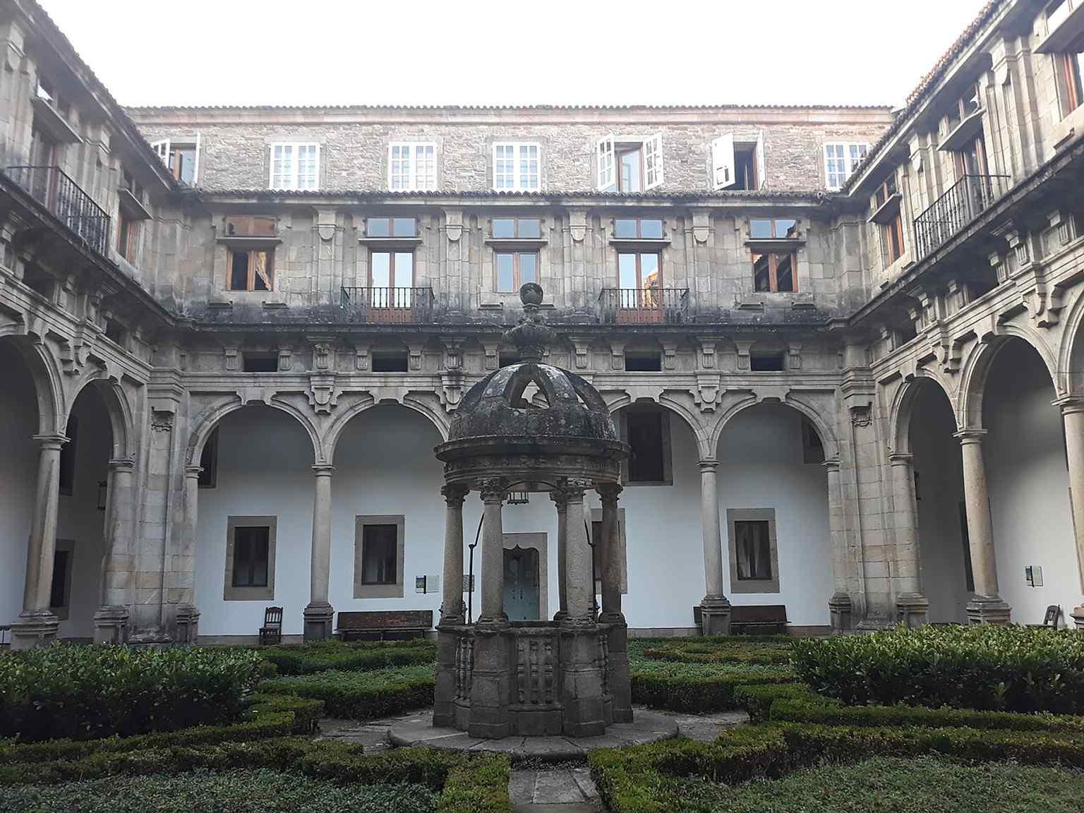 The imposing staircases reflect the architectural grandeur of the building, which has served various functions from a royal hospital to a luxury hotel.