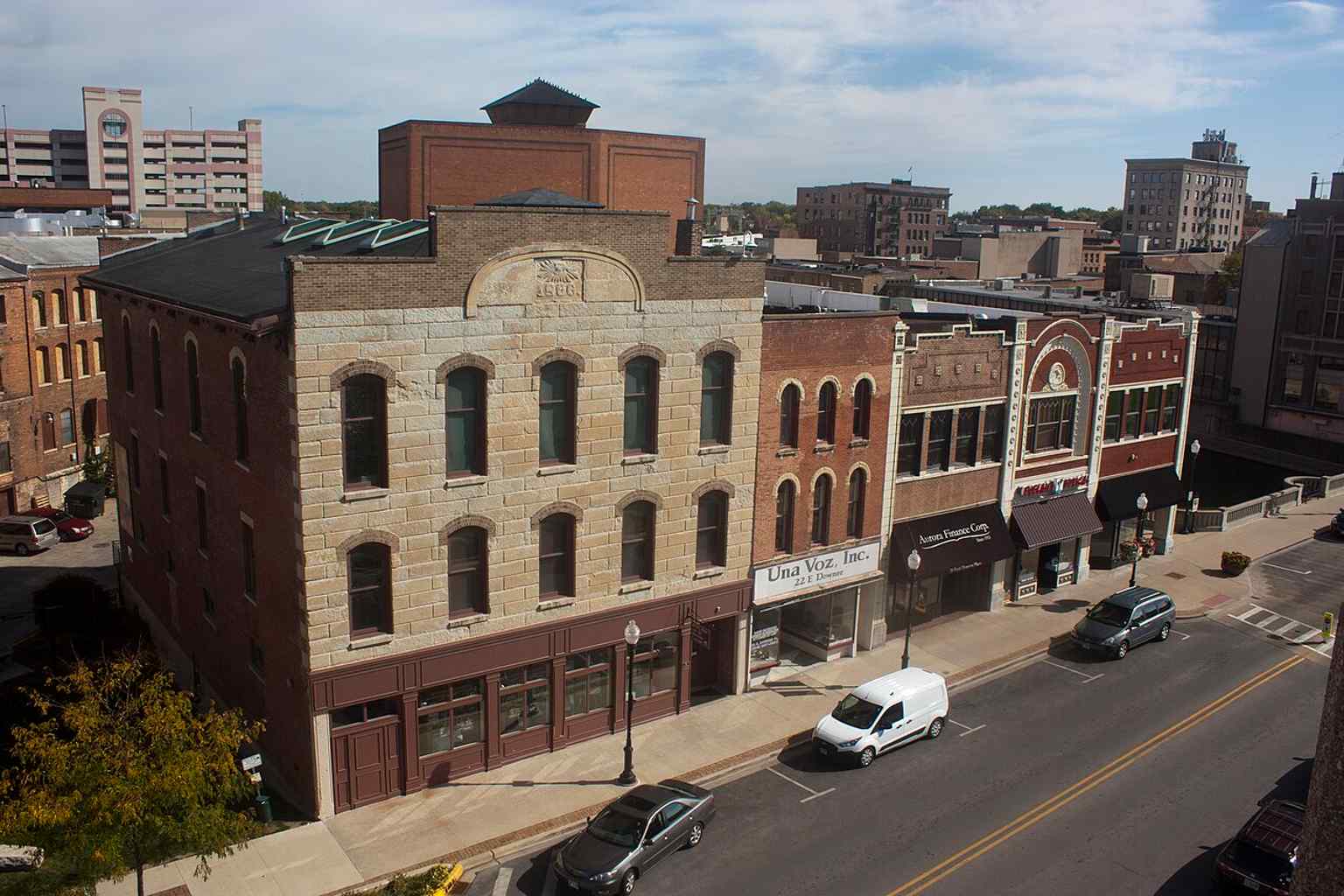 A row of Stolp Island storefronts and the Fox Theatre show the district’s mix of commercial and entertainment buildings.