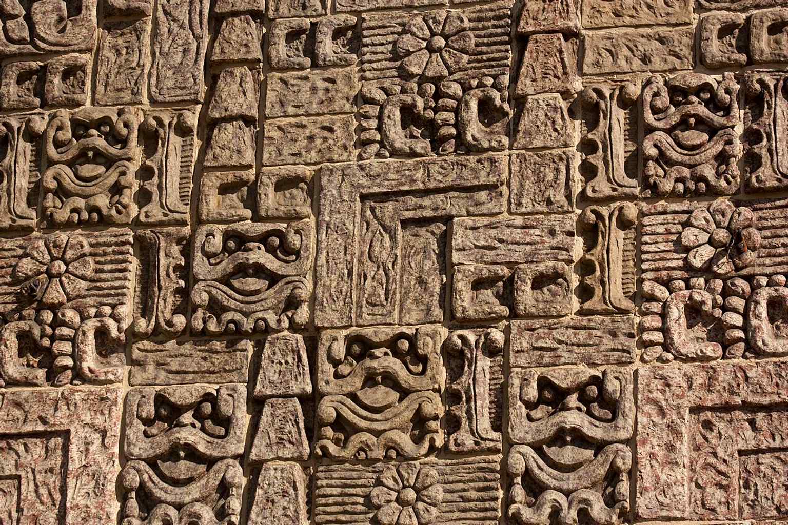 Close-up of the Mayan glyph ornamentation that gives the 1926 lodge its rare Mesoamerican-inspired look.