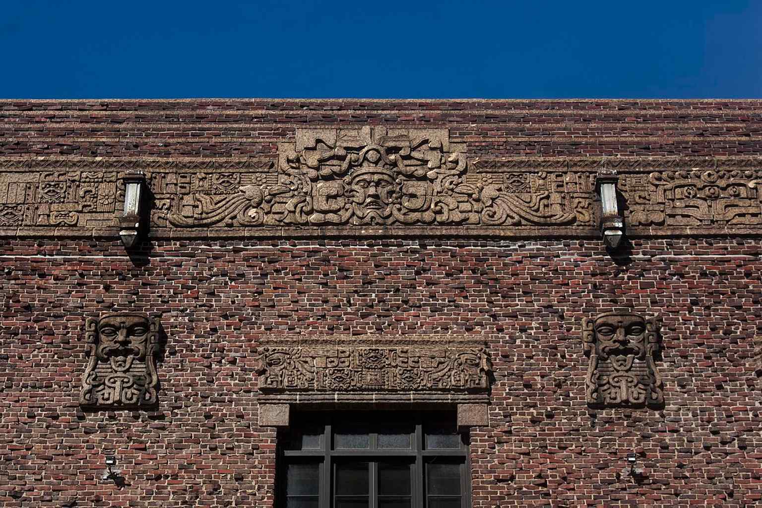 An exterior face detail showing the lodge’s carved Mayan-style motifs, part of the building’s unusual Revival design.